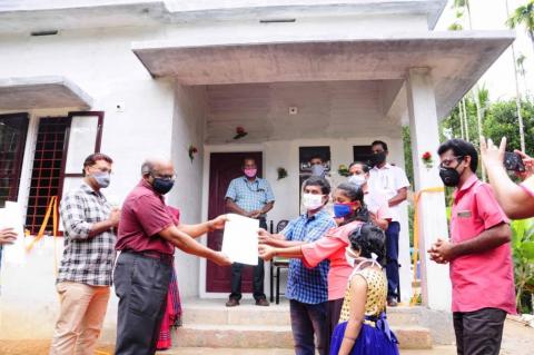 Handing over the documents of newly constructed house as a part of flood relief activity of the station